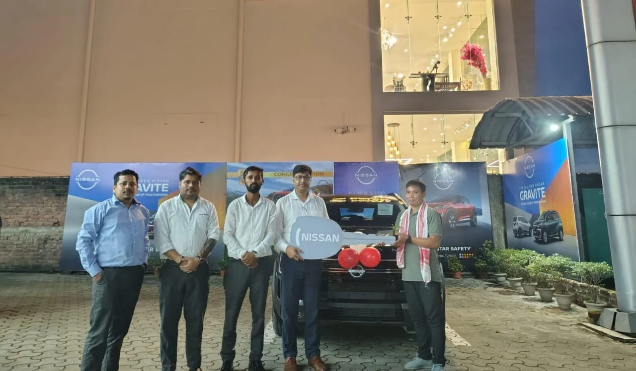 Evening vehicle delivery celebration outside the Binod Nissan showroom